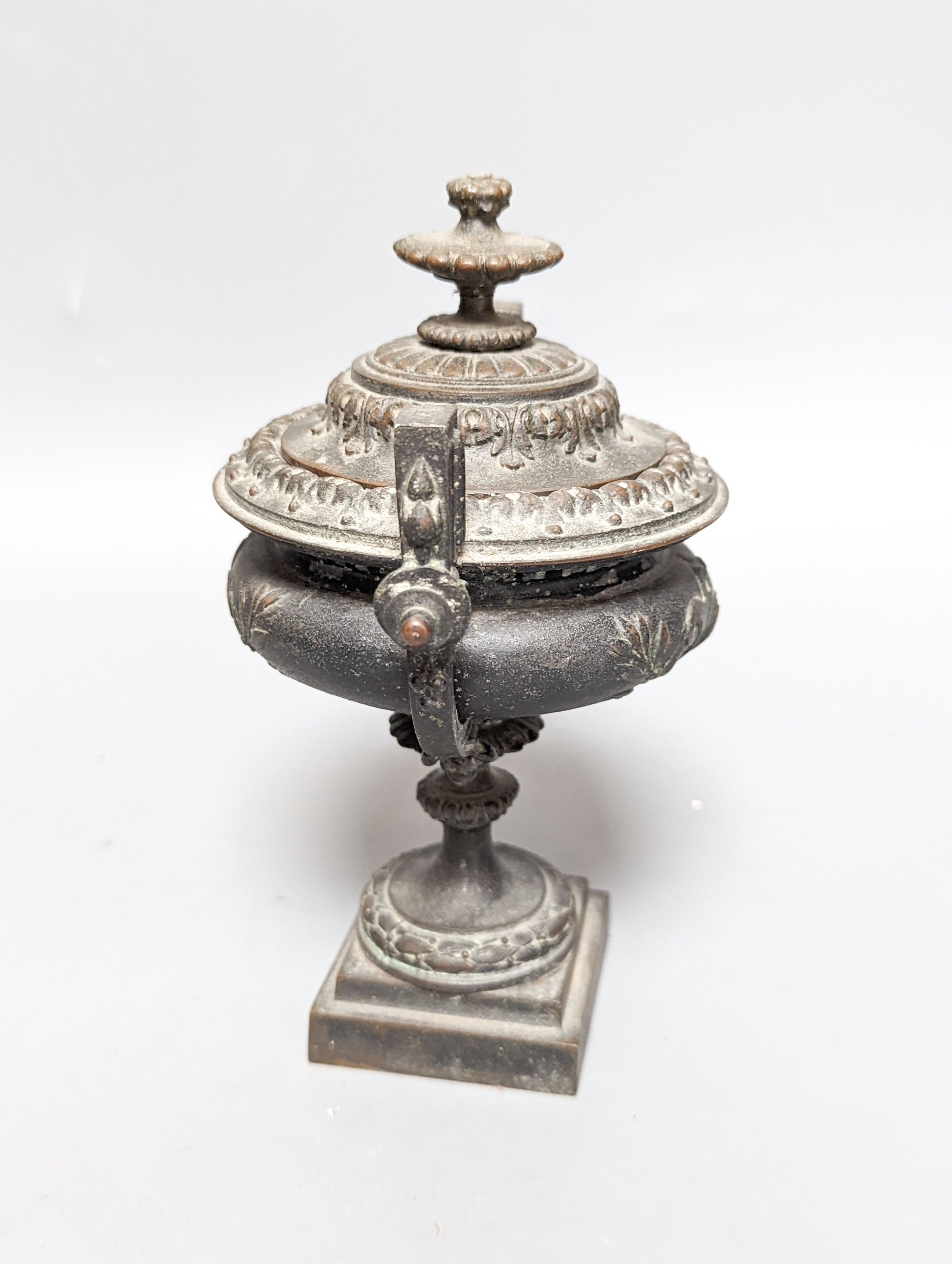 A pair of bronze tazzas on architectural slate bases, c.1900, together with a third, associated piece (3) 25cm